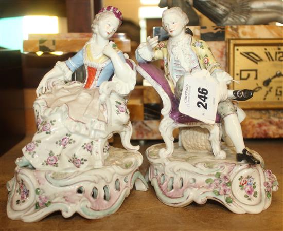 Pair of Dresden porcelain figures of a seated lady and gentleman
